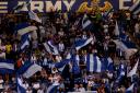 Flag bearers - Colchester United fans will be hoping to cheer their team to a home victory this afternoon