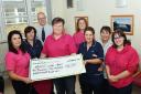 Kerry Wilkinson and friends present £10,588 to the Breast Screening Clinic at West Cumberland Hospital