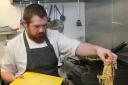 Head chef of Ford Park, Ben Queen-Fryer, prepares and cooks a pasta dish