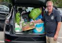 Rotary in Saffron Walden president David Riley with the donations collected at the R A Butler Academy