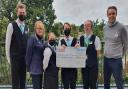 Tesco Saffron Walden store manager Dave Williams, Tesco community champion Susie Diggons and some staff from Cafe Cornell.