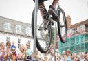 Rich Pearson performs a BMX height jump stunt in Saffron Walden