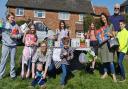 Lana (right), 10, with egg hunt attendees and raffle prizes