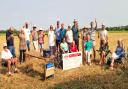 Debden residents celebrate their victory in the field of barley where the bungalows were proposed