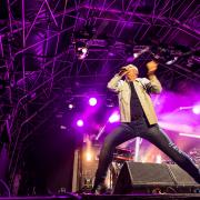 Jim Kerr of Simple Minds on stage at the Heritage Live concert at Audley End House & Gardens in Essex.