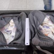 The cash was stuffed into suitcases at Stansted Airport