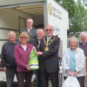 Saffron Walden mayor Richard Porch with Rotary in Saffron Walden colleagues, accepting aid donations for Ukraine at the collection on The Common.