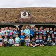 Summer school participants at Joyce Frankland Academy, Newport with Principal Duncan Roberts and Miss Antony, the Head of Year 7