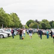 Visitors admire the vintage cars at the show