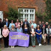 Volunteers and staff gathered outside Saffron Walden Museum at the celebration tea party