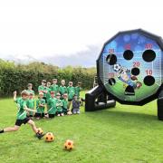 Elsenham Youth Football Club members with the bouncy castle