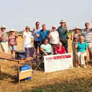 Debden residents celebrate their victory in the field of barley where the bungalows were proposed