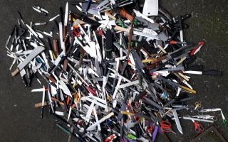 Some of the bladed items placed in a surrender bin