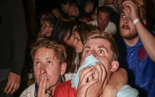 The Low: Fans anxious during the penalty shootout. Picture: Celia Bartlett