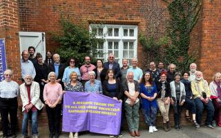 Volunteers and staff gathered outside Saffron Walden Museum at the celebration tea party