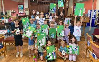 Children illustrating the parable of the lost sheep at Thaxted Messy Church Holiday Club