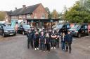 Staff from Gair Homes standing in front of Gair Gas vans