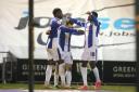 Terrific trio - Colchester United celebrate after scoring against Swindon Town