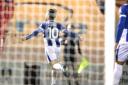 Net gain - Jack Payne celebrates after scoring Colchester United's fourth goal against his old club Swindon Town