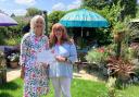 Petrina Lees (left) presenting Lizzy Dunn with the award for Best Garden