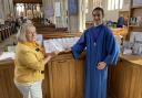 Secretary of the Friends of St Mary's Church Pamela Mugliston shows the translated guide to Ukrainian choral scholar Stas