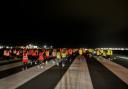 Nearly 100 airport staff ran, jogged, and walked the course