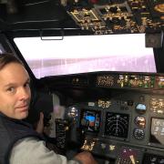 Professional snooker player Ali Carter in the flight simulator