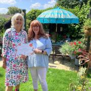 Petrina Lees (left) presenting Lizzy Dunn with the award for Best Garden