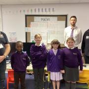 (L-R) Anthony Abery, WW1 Aviation Heritage Trust volunteer, Wimbish Primary Academy pupils, Chris Steadman, senior class teacher, and Cllr Stewart Luck