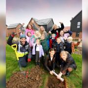 Children and teachers from Newport Primary School buried the time capsule at Hollymead Square