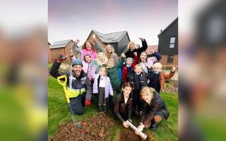 Children and teachers from Newport Primary School buried the time capsule at Hollymead Square