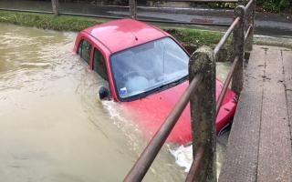 The car submerged in floodwater in Clavering