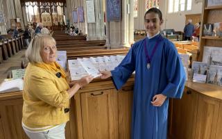 Secretary of the Friends of St Mary's Church Pamela Mugliston shows the translated guide to Ukrainian choral scholar Stas